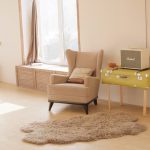 New home maintenance checklist illustrated by a tidy, well organised living space with clean flooring, minimal furniture, and a freshly set-up home interior