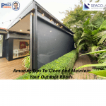 Modern patio with large outdoor blinds surrounded by greenery, illustrating how to clean outdoor blinds