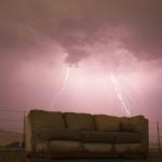 Dirty polyester soaking wet couch in the storm