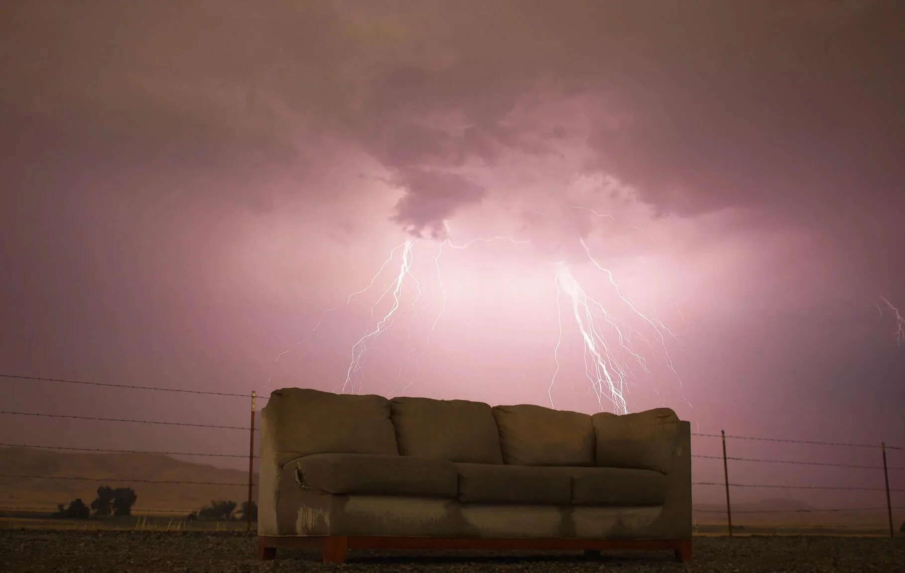 Dirty polyester soaking wet couch in the storm